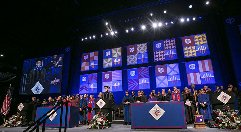 Chaplain Tom Judge, offers an invocation Sunday, June 11, 2017, during the DePaul University Driehaus College of Business commencement ceremony